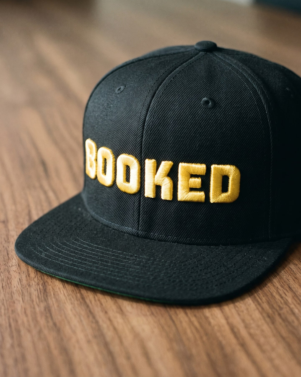 The Booked Solid Cap, close-up of the puff embroidery