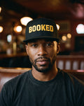 The Booked Solid Cap, worn