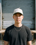 The CAC Mirror Cap, worn