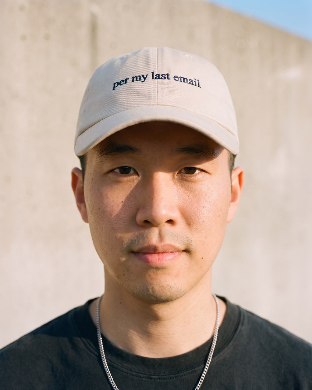 The Per My Last Email Dad Hat, worn close-up
